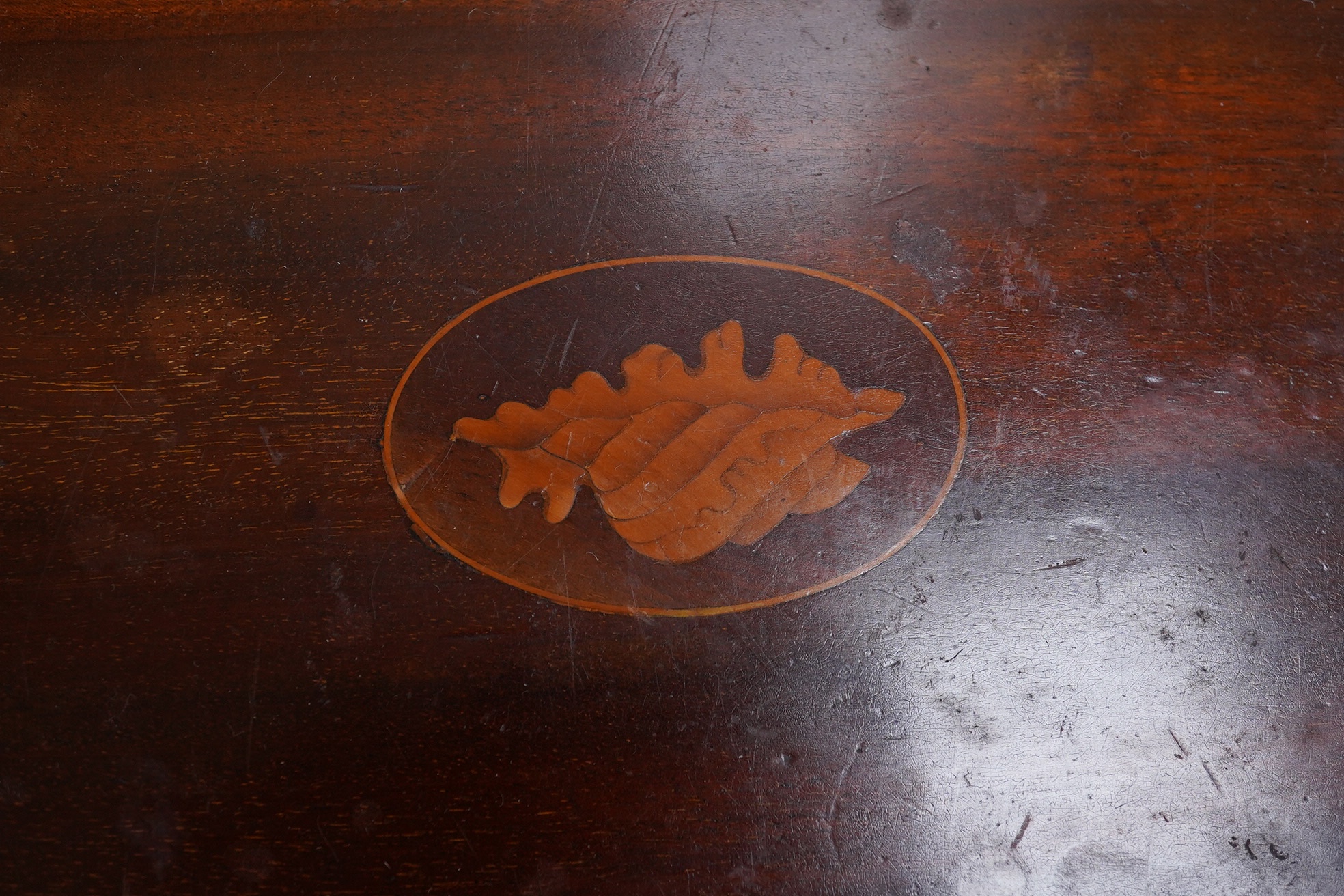 Three various mahogany trays including an Edwardian inlaid and galleried example, largest 61cm wide. Condition - fair